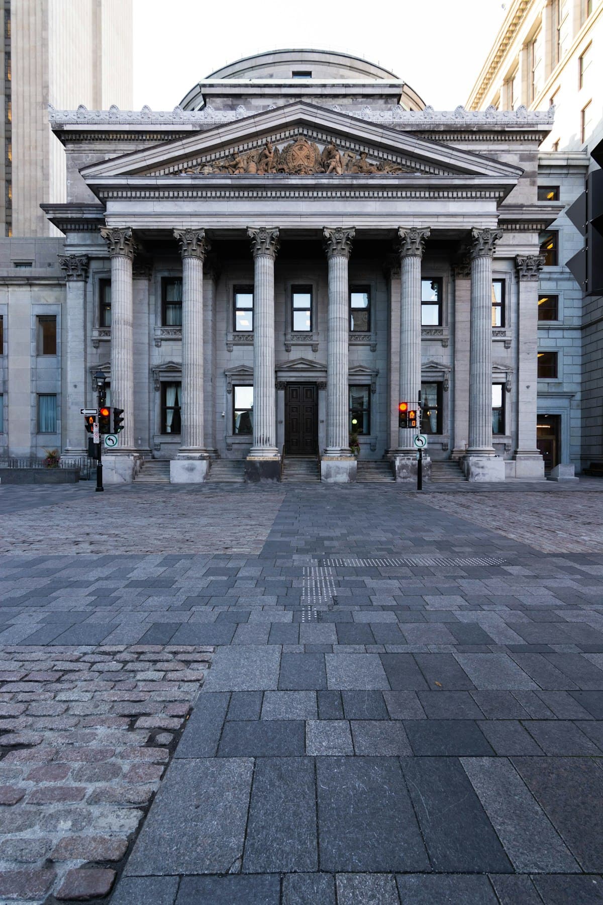 Grand classical building facade with columns, evoking financial and institutional gravitas